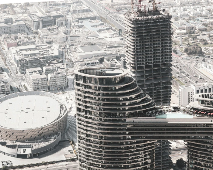 Modern architectural buildings under construction and completed.